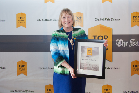 Ann Treacy, Waterford Institute's vice president of human resources and facilities, receives the Top Workplaces award. 