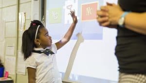 young black girl uses Classroom Advantage on whiteboard