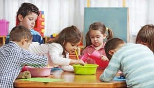 kindergarten children playing with toys
