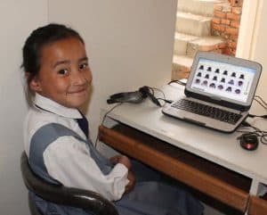 Nepalese student using Waterford on laptop