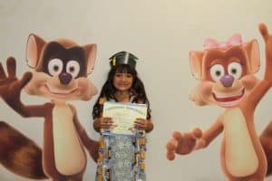 UPSTART student at graduation with Rusty and Rosy