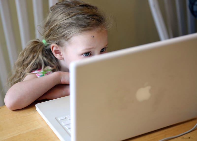 UPSTART student on laptop