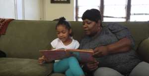 Grandmother reading to child