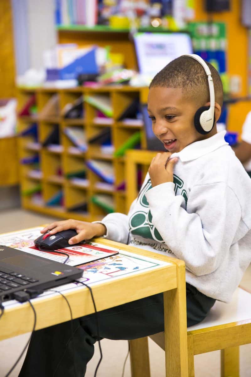 boy using Waterford on desktop computer