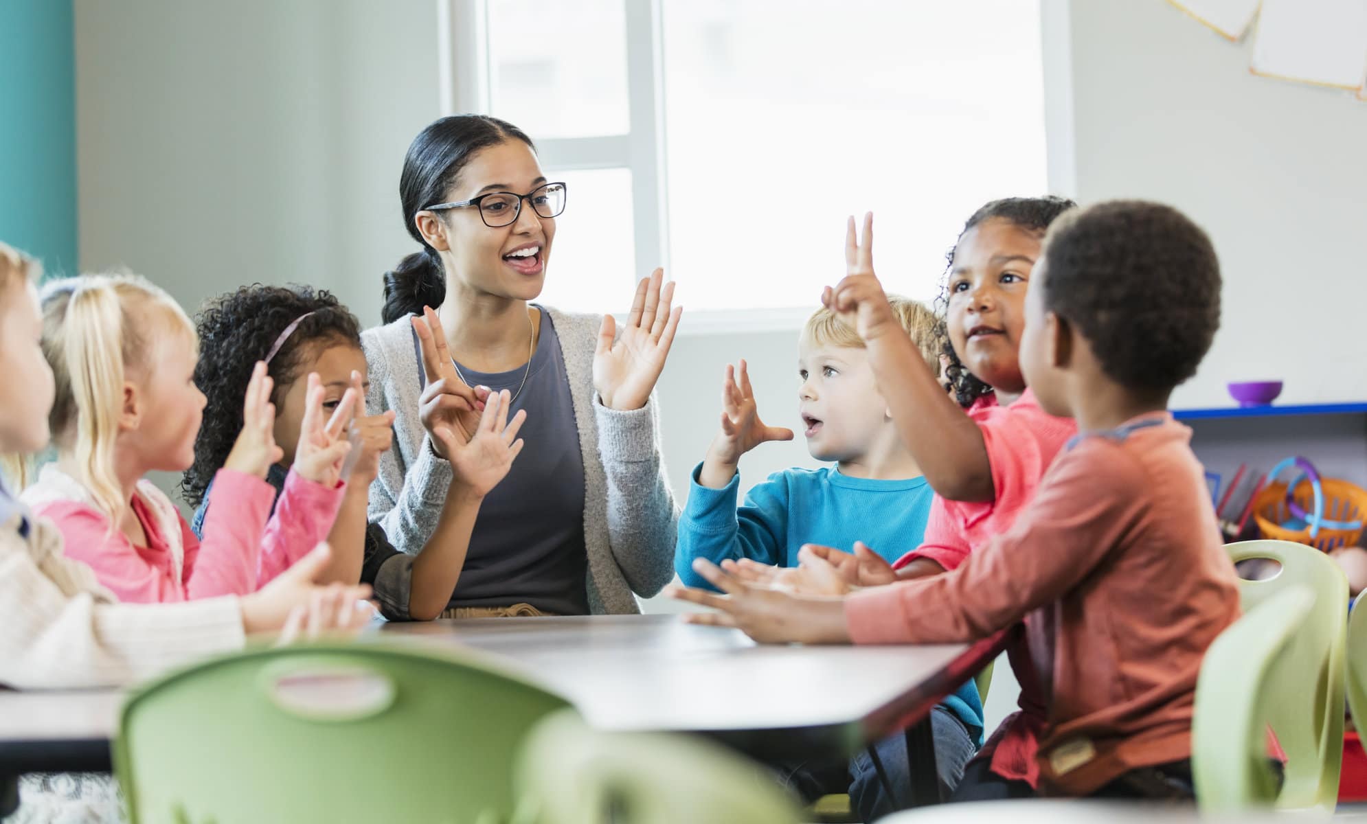 stock photo of teacher and student in a classroom