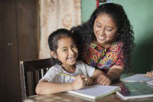 mom and daughter doing homework