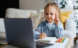 Young student participating in back to school night online