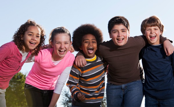 happy students with conflict resolution techniques in the classroom