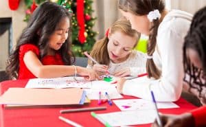 Friends making winter arts and crafts together. Find child-friendly winter crafts