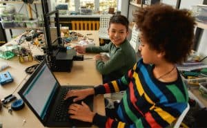 Two students work together on coding and other STEM activities