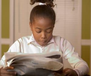 Student reading a newspaper