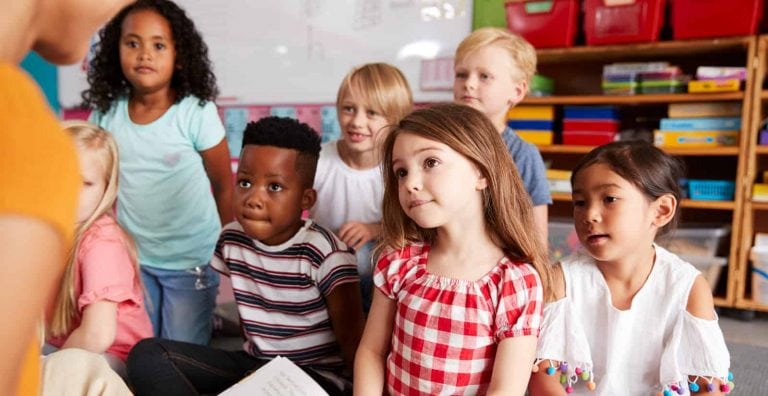 A teacher reading to the classroom