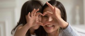 A mother and daughter. Using a two generation approach means educators can work to address the needs of a child's family at home, leading to success in school.