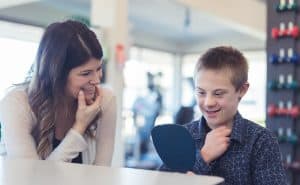 A speech therapist working with a student.