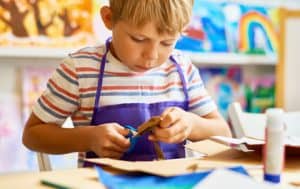 A student making an art project.
