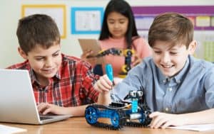 Students working to build a robot in STEM class.