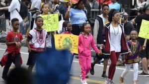 Children march in a Juneteenth parade in Philadelphia, Pennsylvania. Find ways to celebrate and learn about Juneteenth.