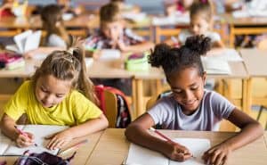 Two students working side by side. Find out what lessons we've learned about curriculum from the pandemic.