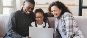 family using a laptop