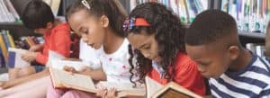 students reading in library