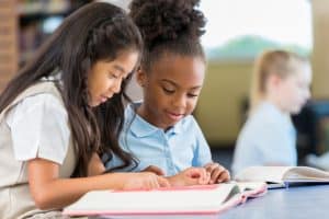 students reading a book