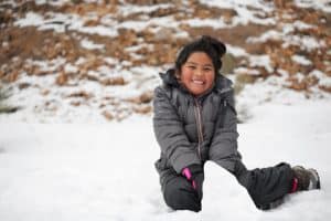 Child playing in snow