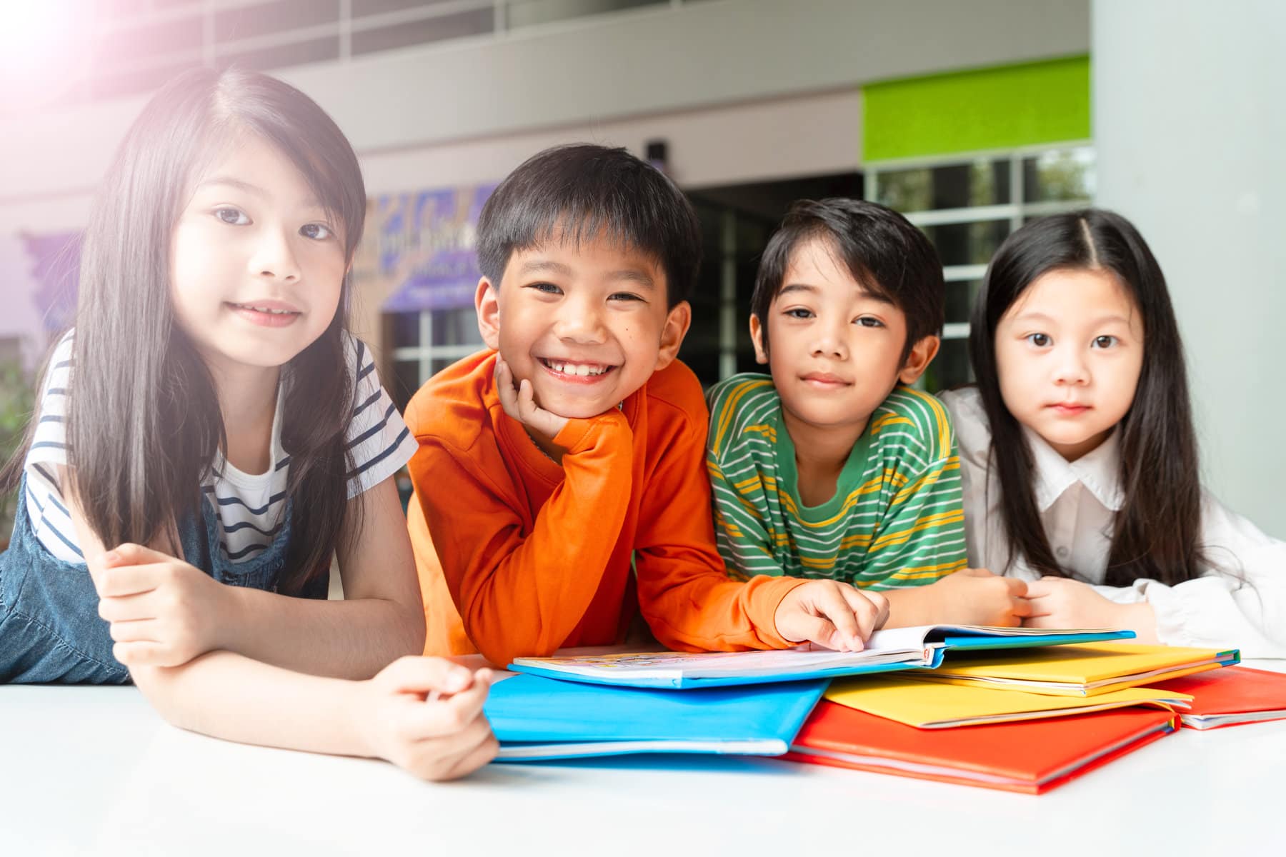 a group of students reading a book