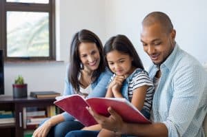 family reading a book