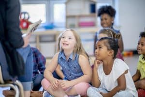 group of students reading with teacher