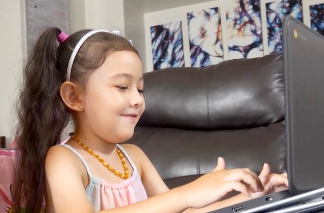 Raven working on Waterford Upstart on a laptop.